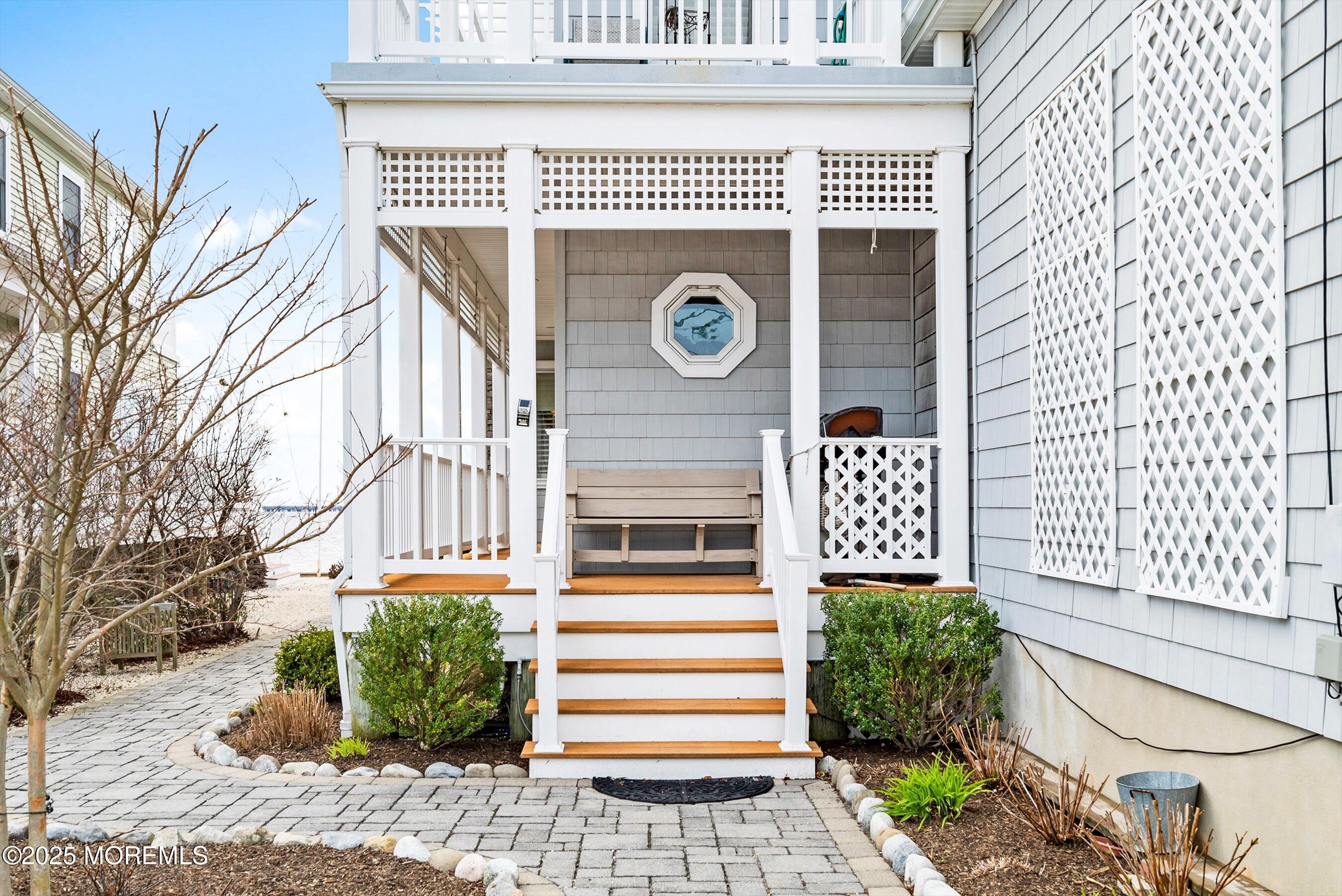 133 Pershing Boulevard Lavallette, NJ 08735 - Photo 13 of 86 a front view of a house with a yard