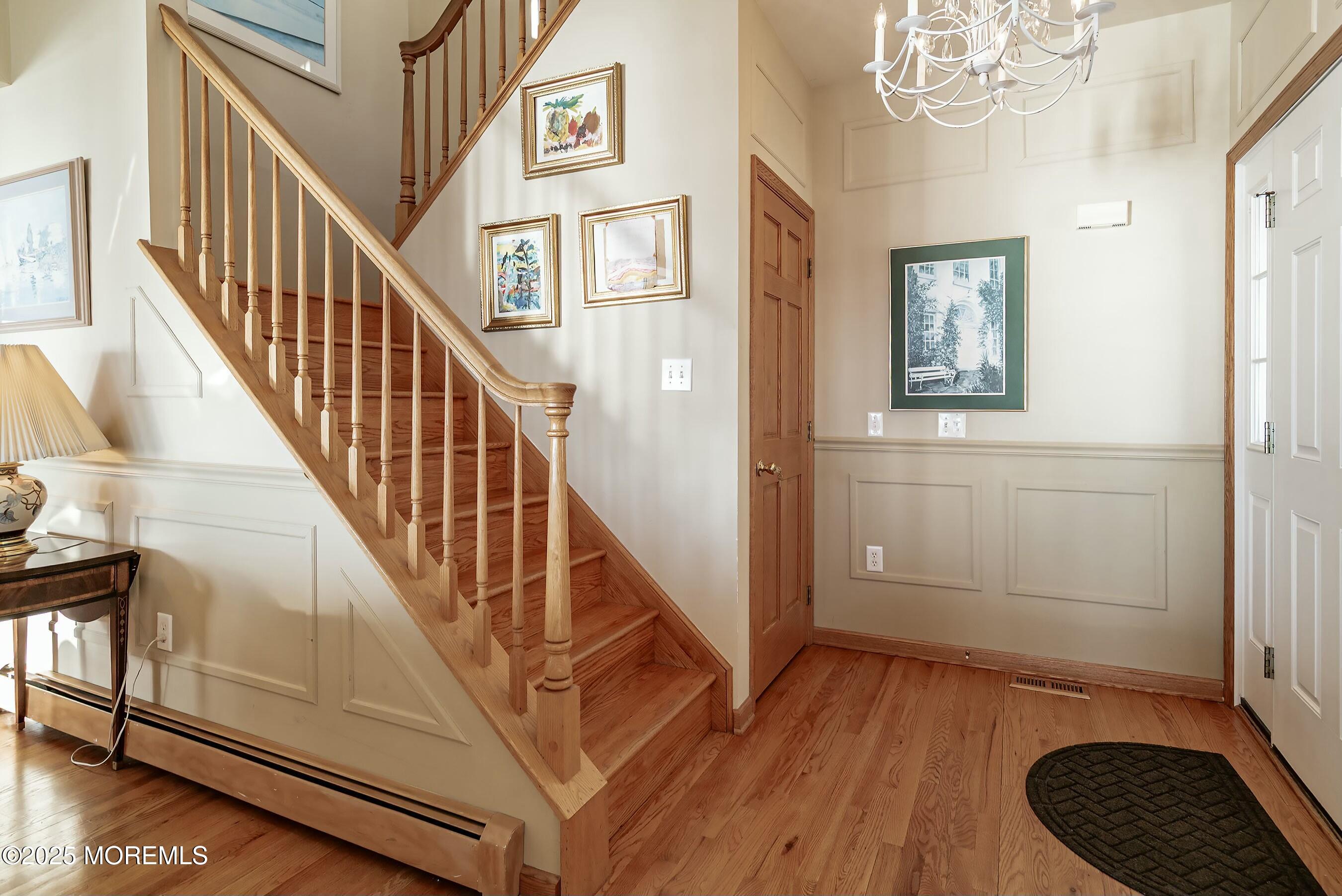 133 Pershing Boulevard Lavallette, NJ 08735 - Photo 14 of 86 a view of entryway and hall with wooden floor