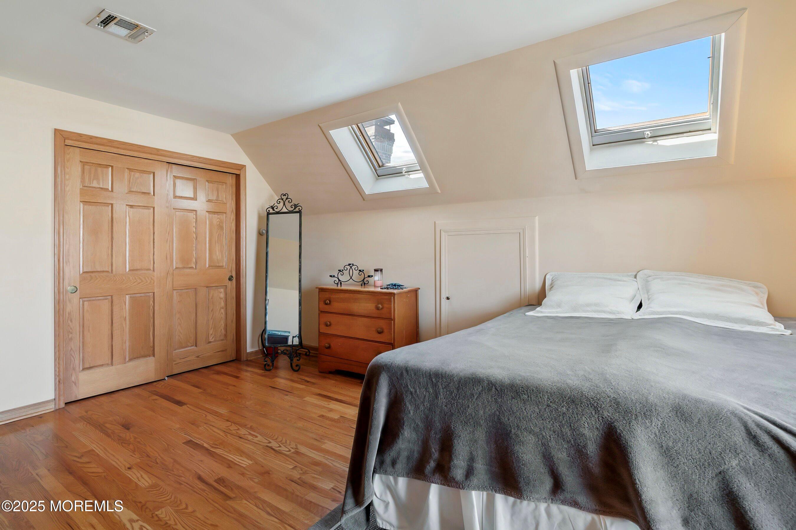 133 Pershing Boulevard Lavallette, NJ 08735 - Photo 57 of 86 a bedroom with a bed and a closet