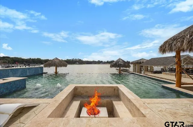 a view of swimming pool with a lake view