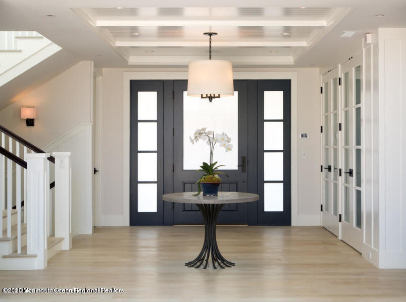 85 Black Point Road Rumson, NJ 07760 - Photo 2 of 10 a living room with furniture and a chandelier