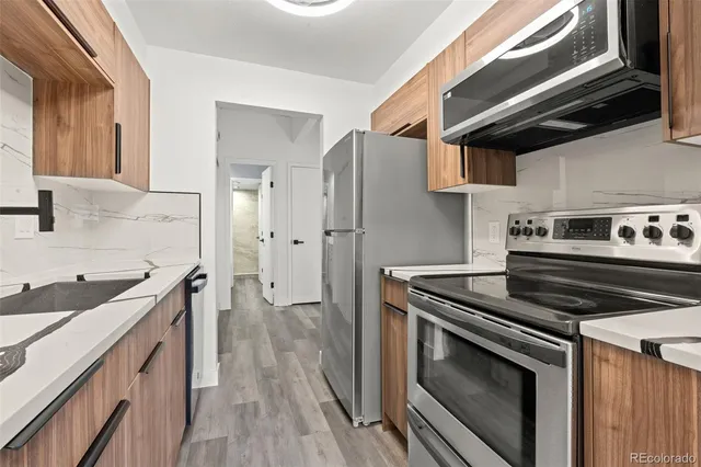 a kitchen with a stove and a sink