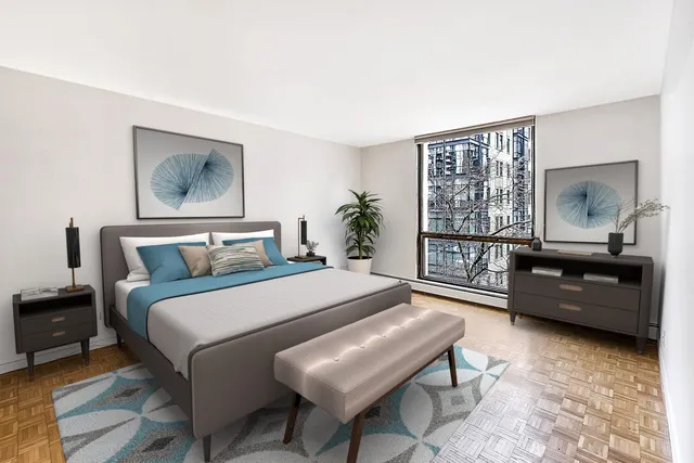 a bedroom with a bed and a window