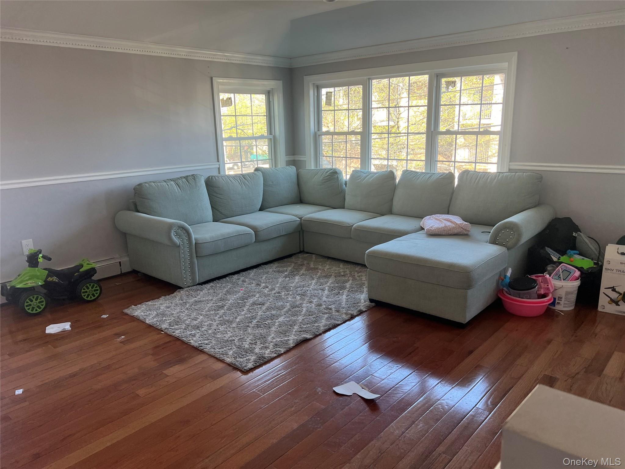 189-20 117th Road Queens, NY 11412 - Photo 16 of 26 a living room with furniture and a window
