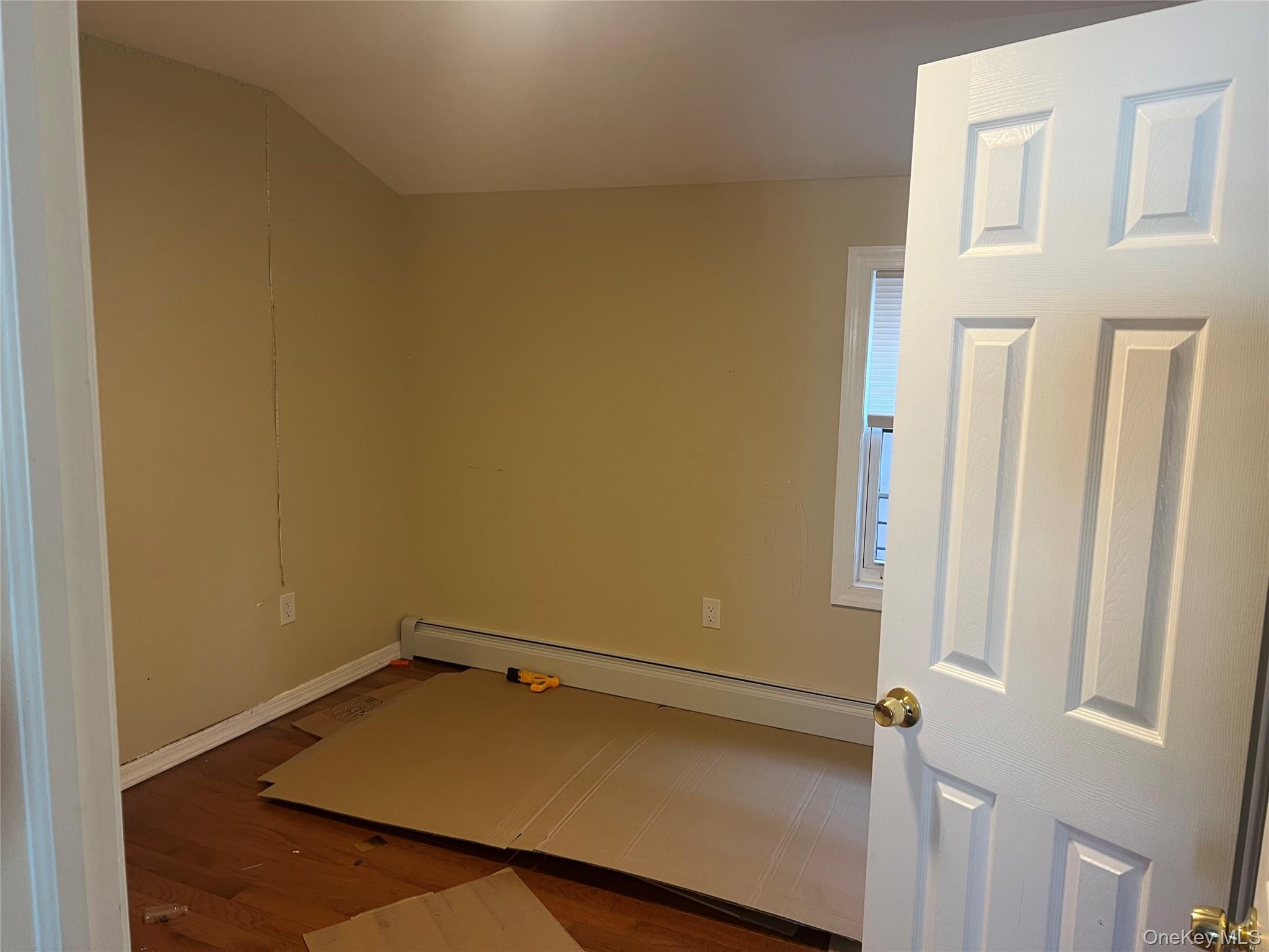 189-20 117th Road Queens, NY 11412 - Photo 18 of 26 a view of a small space with wooden floor