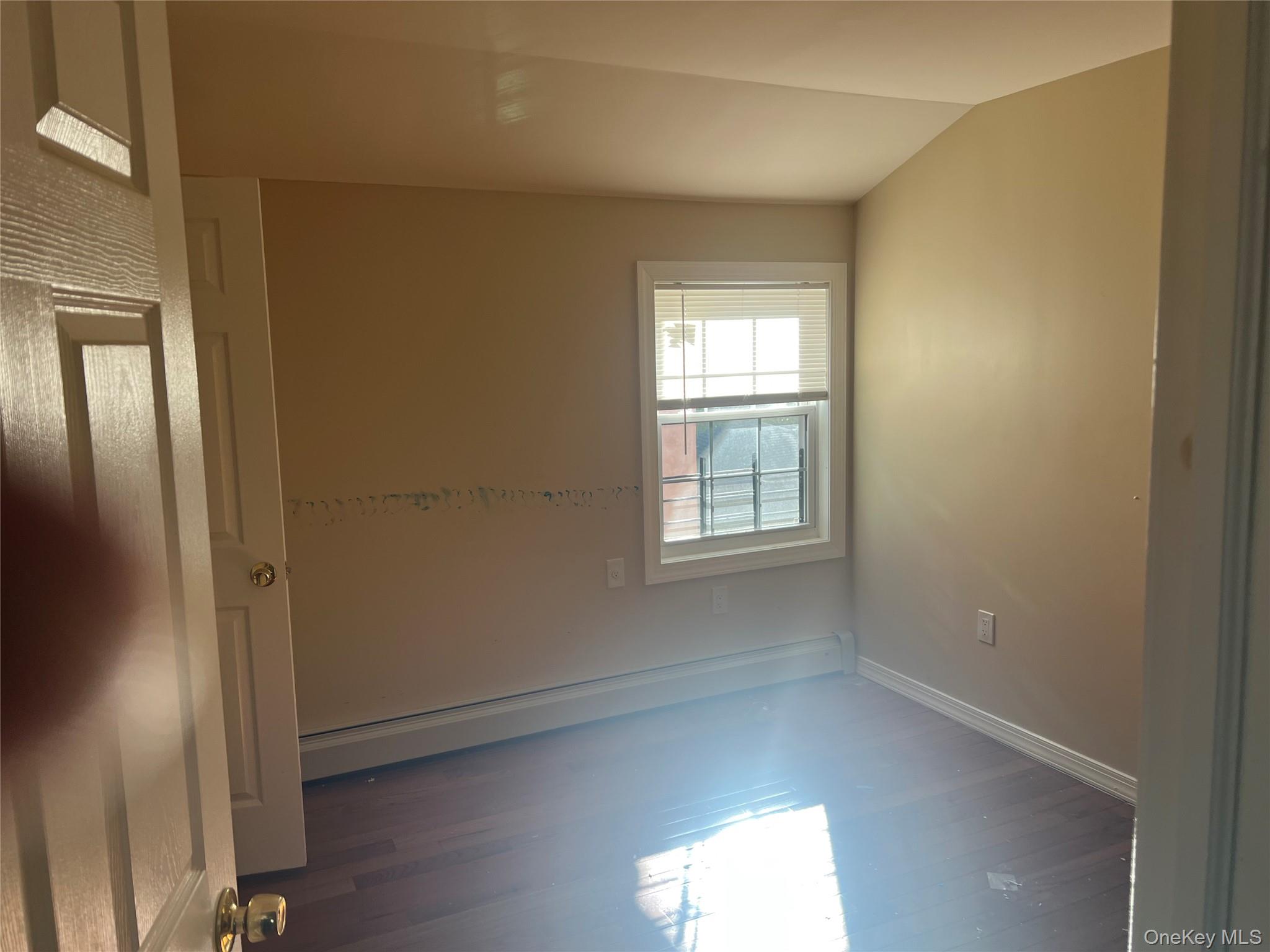 189-20 117th Road Queens, NY 11412 - Photo 21 of 26 an empty room with windows