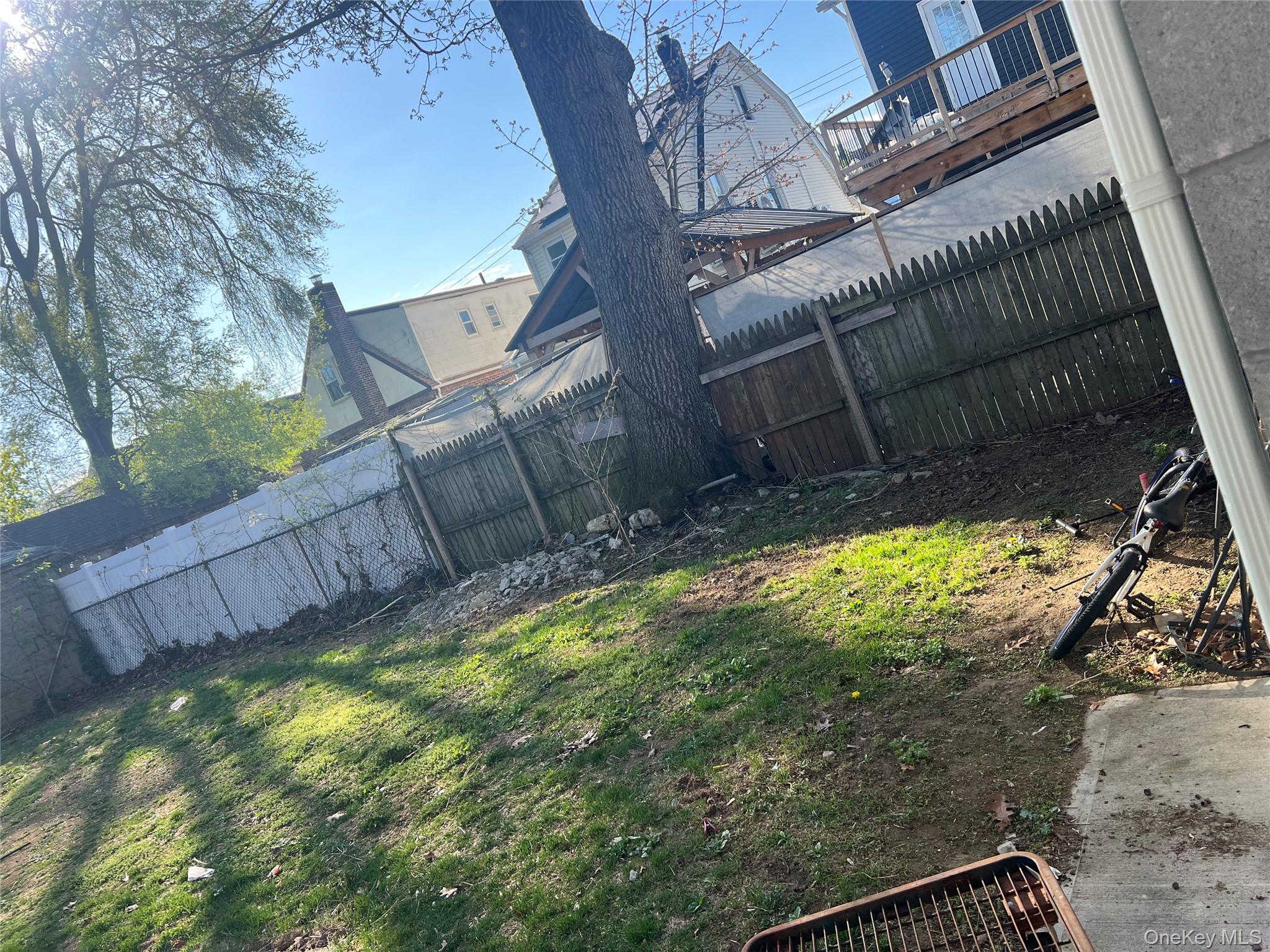 189-20 117th Road Queens, NY 11412 - Photo 5 of 26 a view of a backyard with a tree