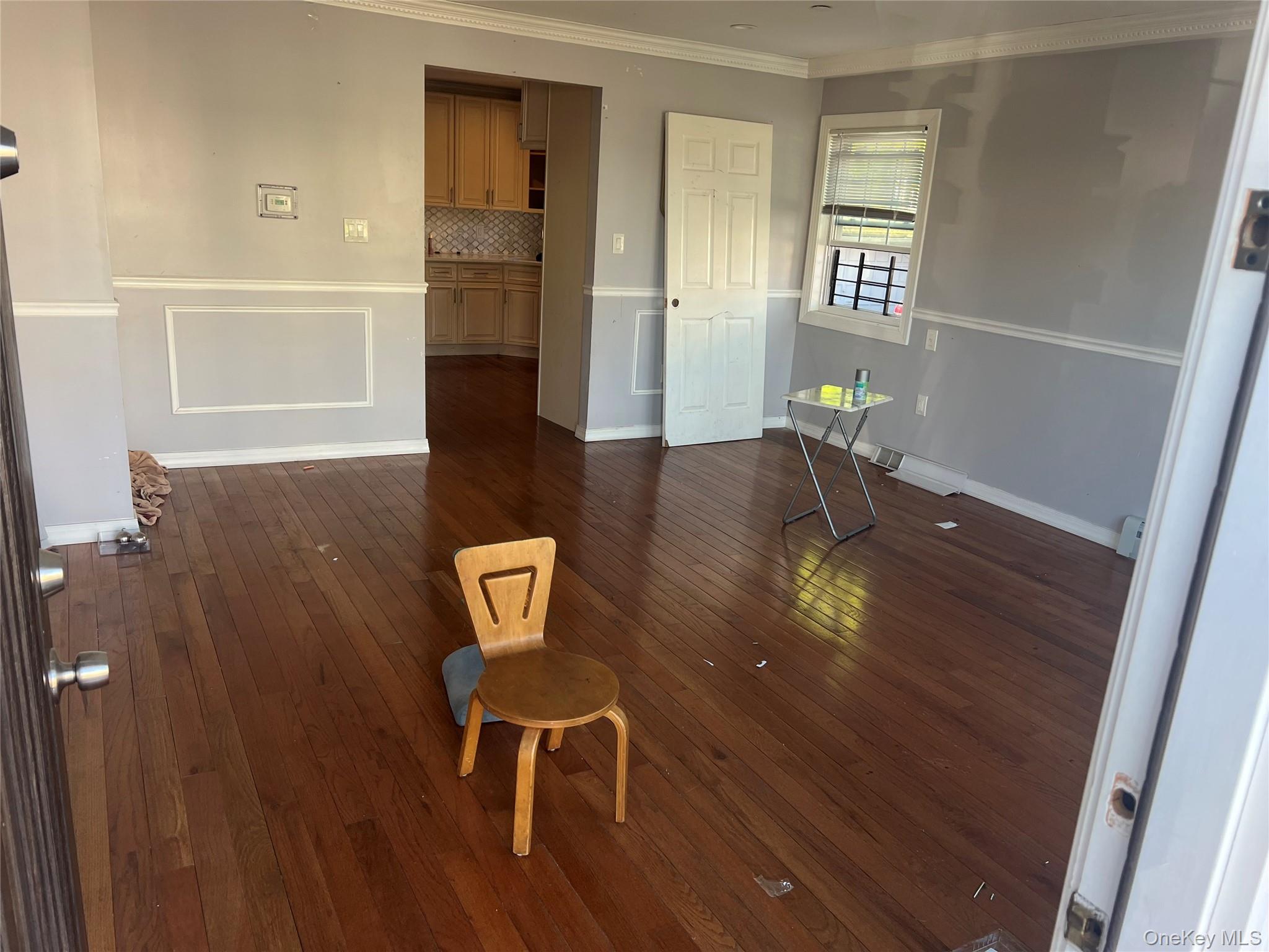 189-20 117th Road Queens, NY 11412 - Photo 7 of 26 a view of a dining room with furniture and wooden floor