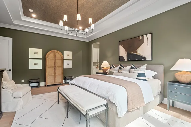 a view of a livingroom with furniture wooden floor and windows