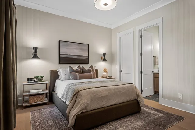 a bedroom with a bed and a couch