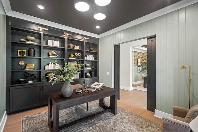 a dining room with furniture and window