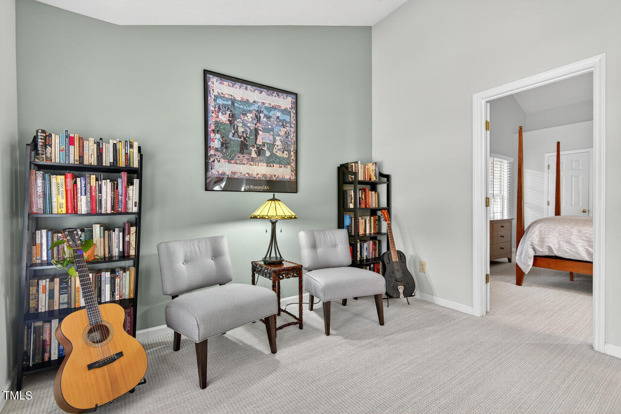 123 Weatherhill Point Carrboro, NC 27510 - Photo 7 of 25 a living room with furniture and a book shelf