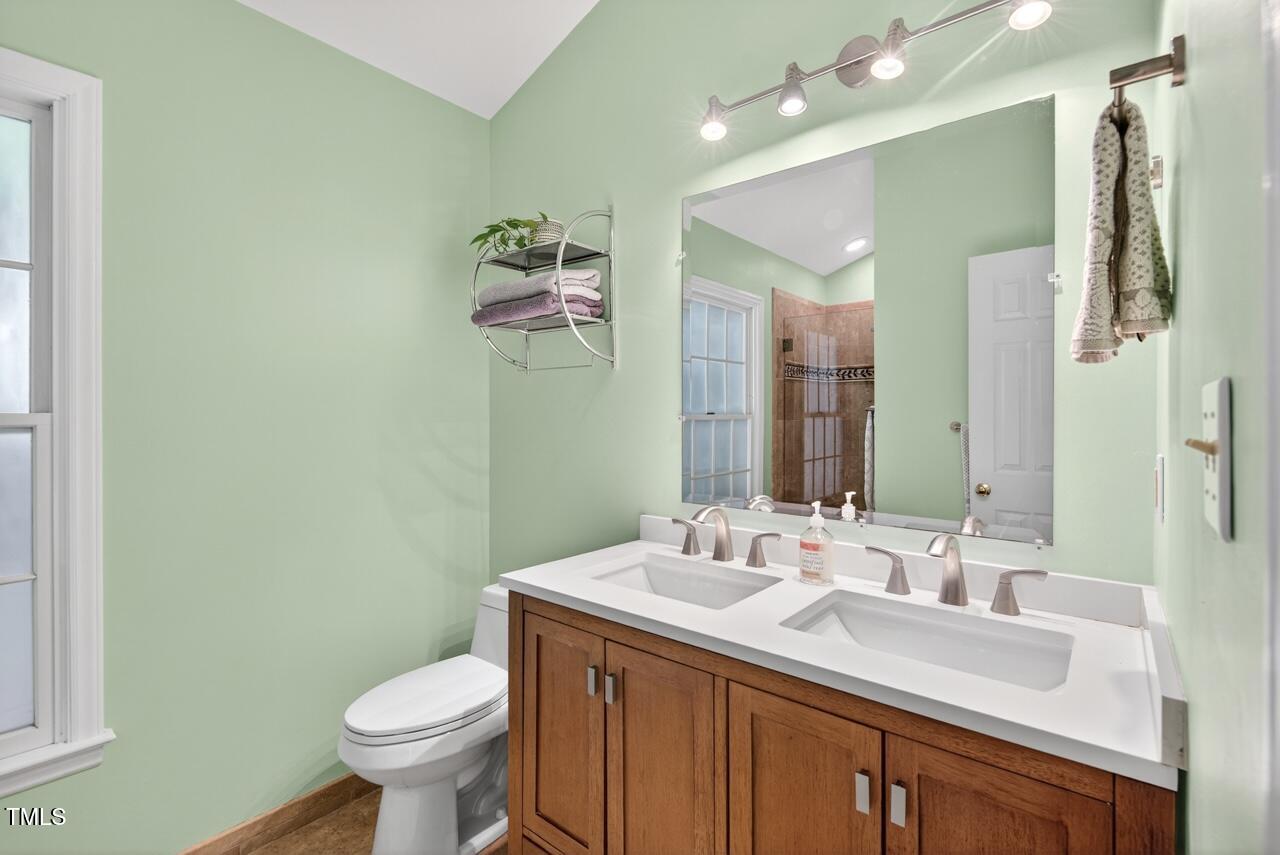 123 Weatherhill Point Carrboro, NC 27510 - Photo 9 of 25 a bathroom with a sink and a mirror