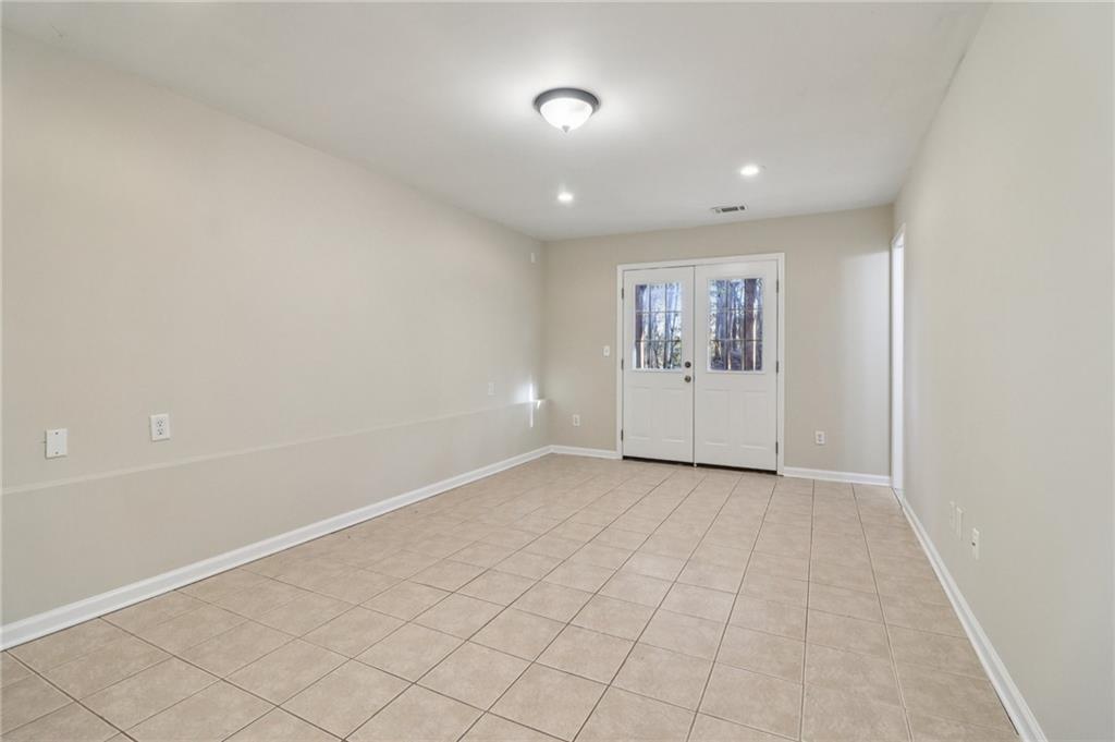 572 Casey's Crossing Winder, GA 30680 - Photo 21 of 31 an empty room with wall painting and windows