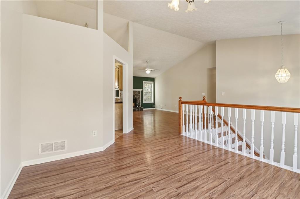 572 Casey's Crossing Winder, GA 30680 - Photo 3 of 31 a view of a hallway with wooden floor
