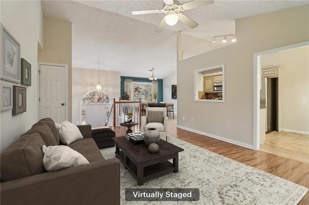 572 Casey's Crossing Winder, GA 30680 - Photo 5 of 31 a living room with furniture and a wooden floor