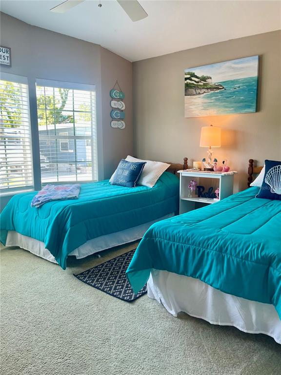11200 Walsingham Road, Unit 139 Largo, FL 33778 - Photo 8 of 13 a bedroom with a bed and window