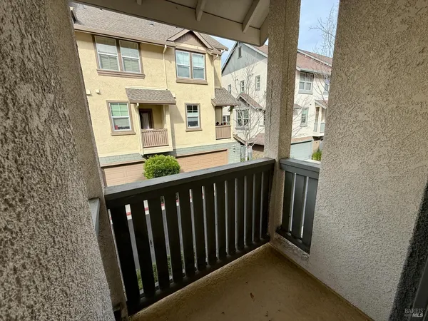 a view of a balcony with front door