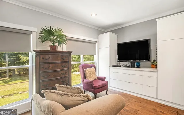 a living room with furniture and a flat screen tv