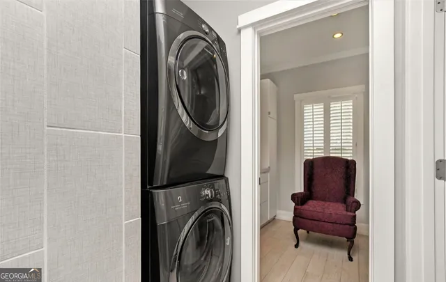 a view of a hallway with washer and dryer