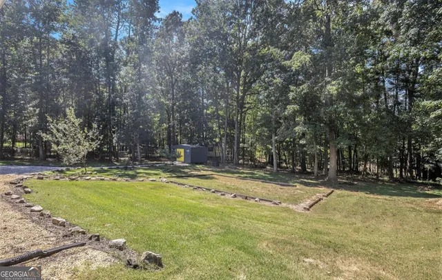 a view of swimming pool with trees