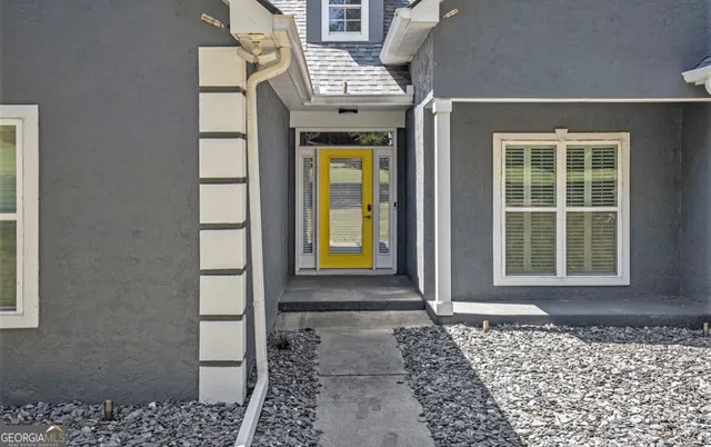 a front view of a house with a gate