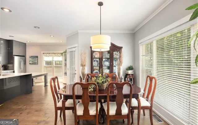 a view of a dining room with furniture and window