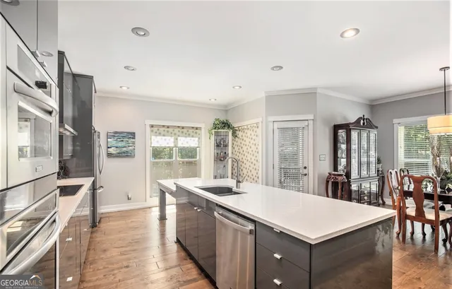 a large white kitchen with a large window