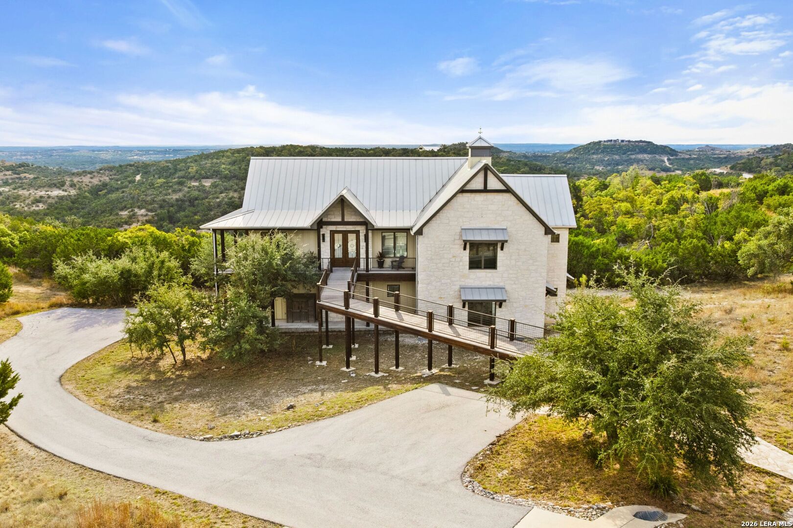 1600 Brushy Ridge Trail Blanco, TX 78606 - Photo 2 of 43 a view of a swimming pool with a lounge chairs