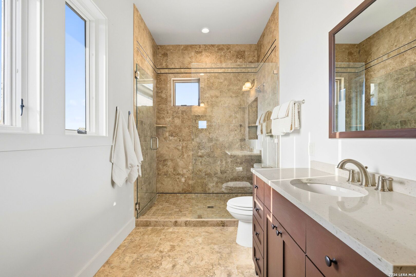 1600 Brushy Ridge Trail Blanco, TX 78606 - Photo 25 of 43 a bathroom with a sink a toilet a shower and a mirror