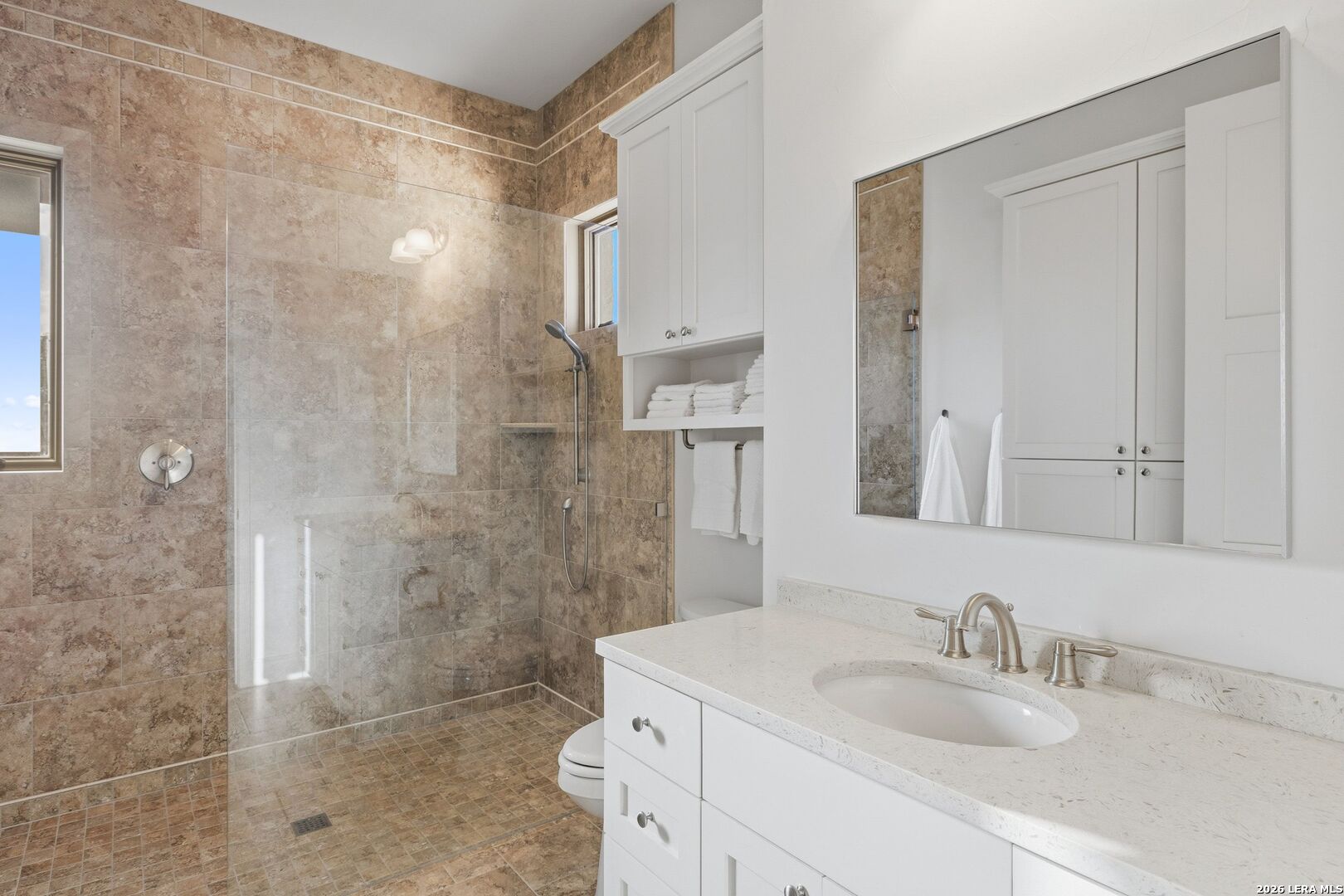 1600 Brushy Ridge Trail Blanco, TX 78606 - Photo 35 of 43 a bathroom with a sink a toilet and shower