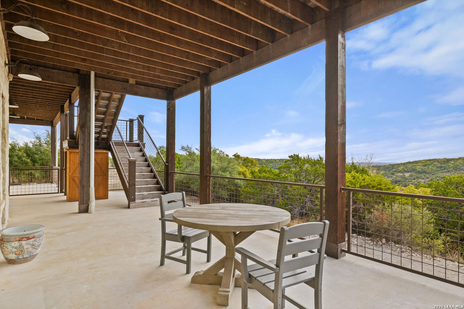 1600 Brushy Ridge Trail Blanco, TX 78606 - Photo 36 of 43 a view of a patio with a table chairs and backyard