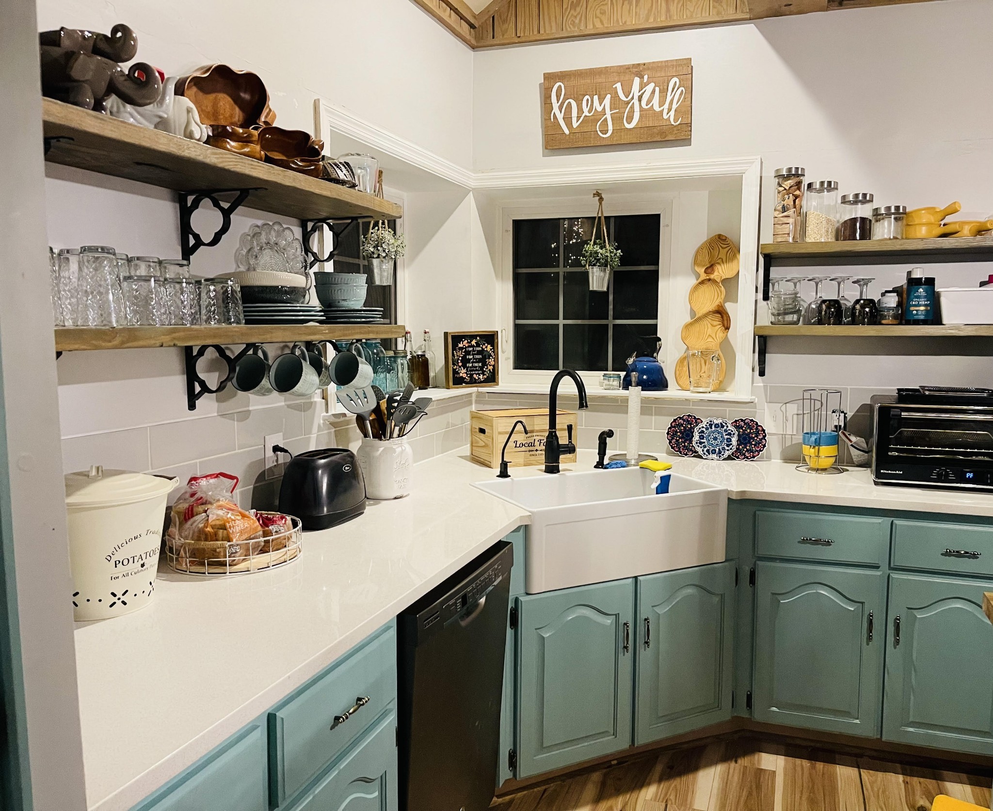 a kitchen with a sink a stove and cabinets
