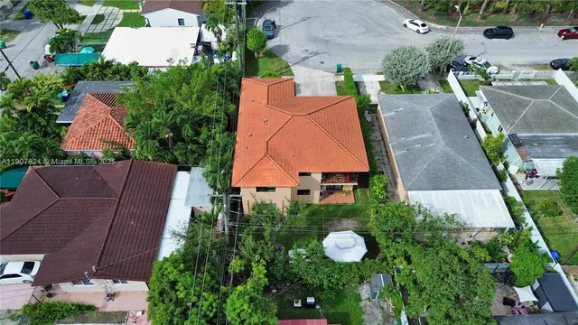 an aerial view of a house with a garden