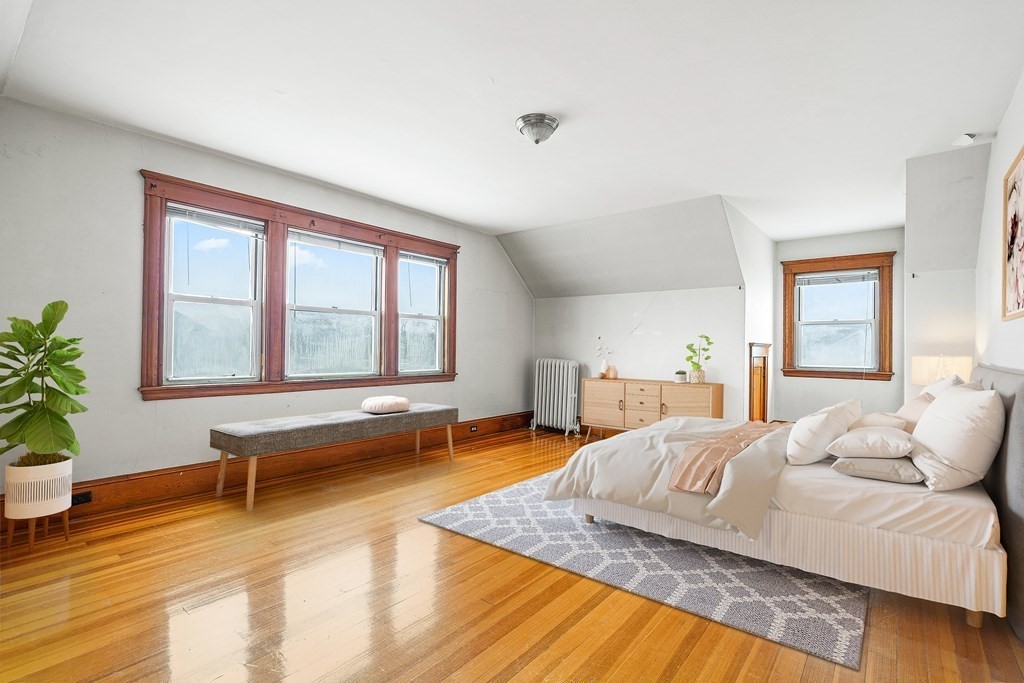 73 Halifax Street Boston, MA 02130 - Photo 8 of 18 a bedroom with a bed and a window