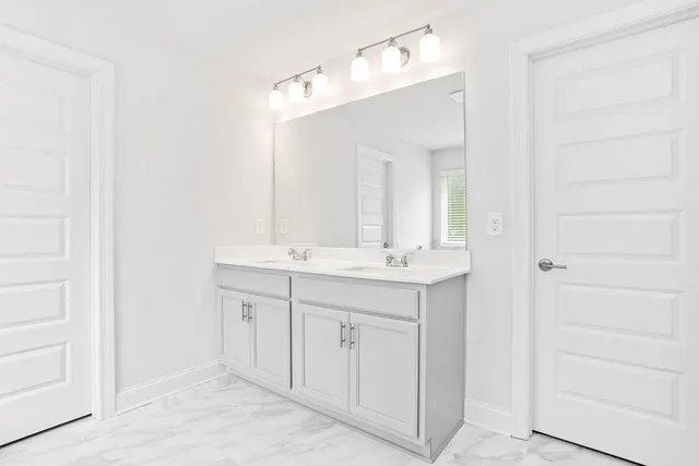 a white bath tub sitting next to a window