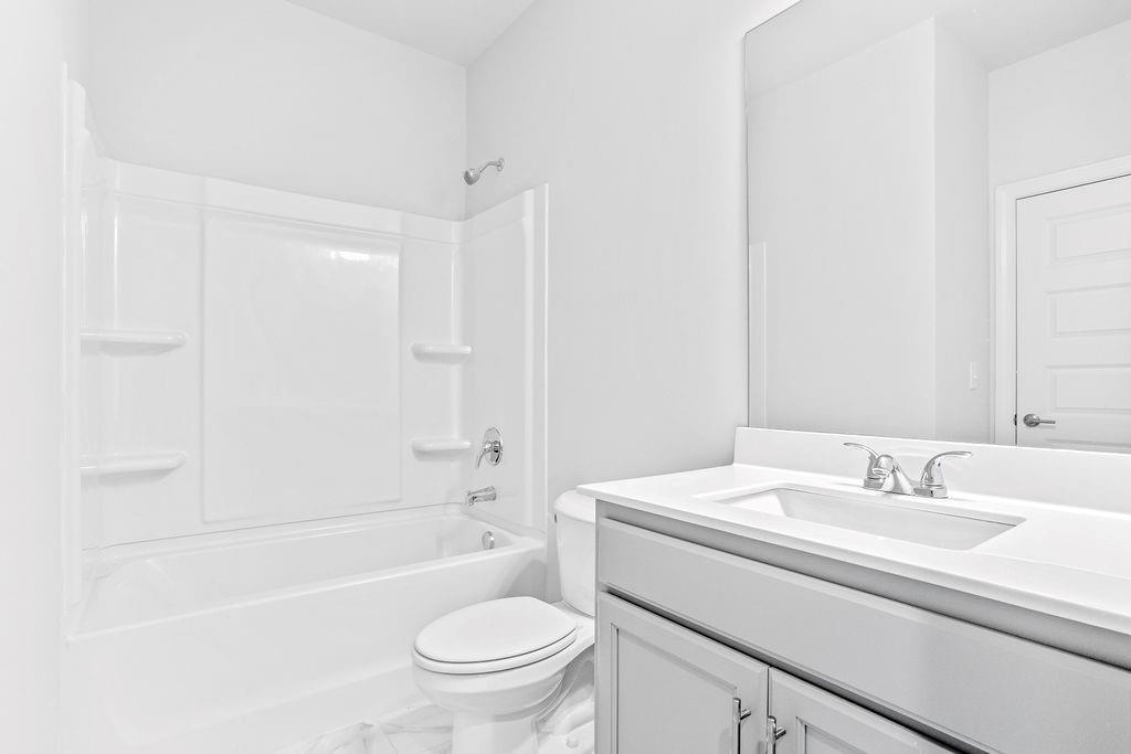 70 Cooper Drive Mansfield, GA 30055 - Photo 24 of 32 a bathroom with a sink toilet and shower