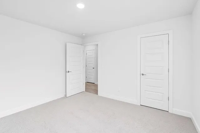 a bathroom with a toilet a sink a bathtub and a mirror