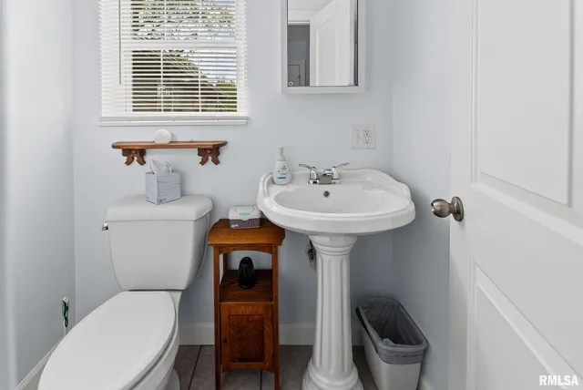 an aerial view of a house with a yard basket ball court and outdoor seating