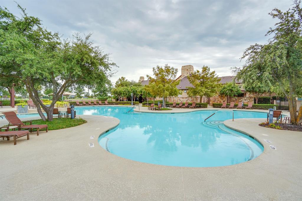 9109 Perimeter Street Denton, TX 76207 - Photo 27 of 27 Community pool with a patio area