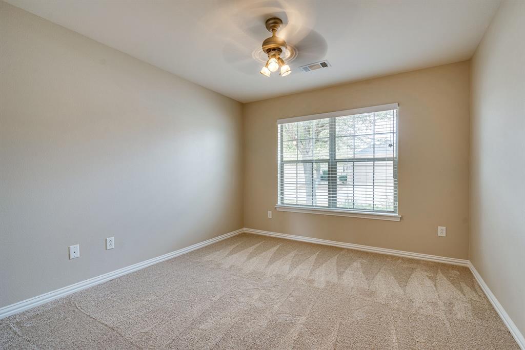 9109 Perimeter Street Denton, TX 76207 - Photo 5 of 27 Carpeted empty room featuring baseboards and a ceiling fan
