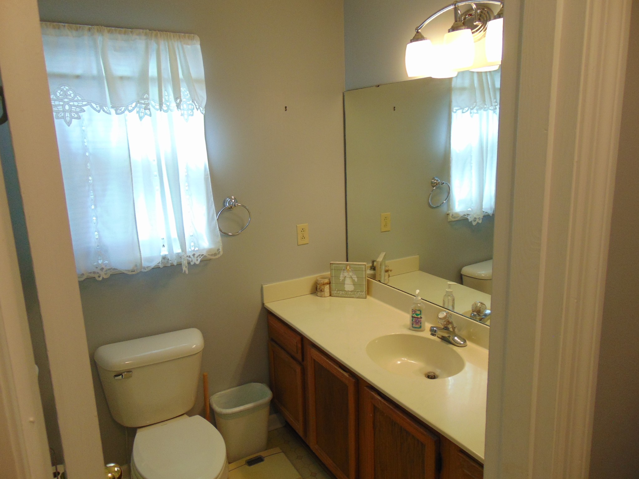 1684 Springplace Road Lewisburg, TN 37091 - Photo 13 of 48 a bathroom with a toilet sink and mirror