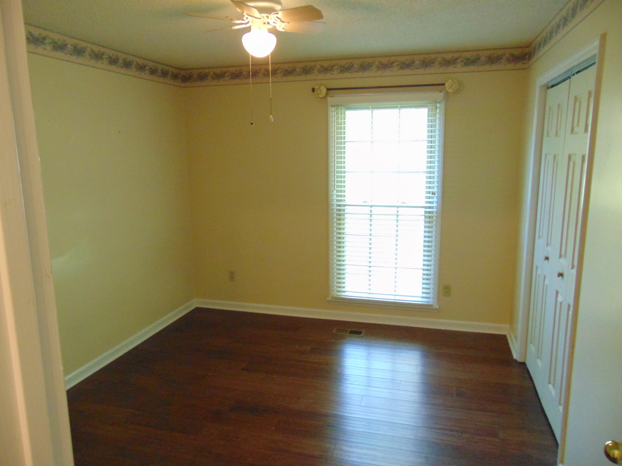 1684 Springplace Road Lewisburg, TN 37091 - Photo 15 of 48 a view of a room with wooden floor and a window