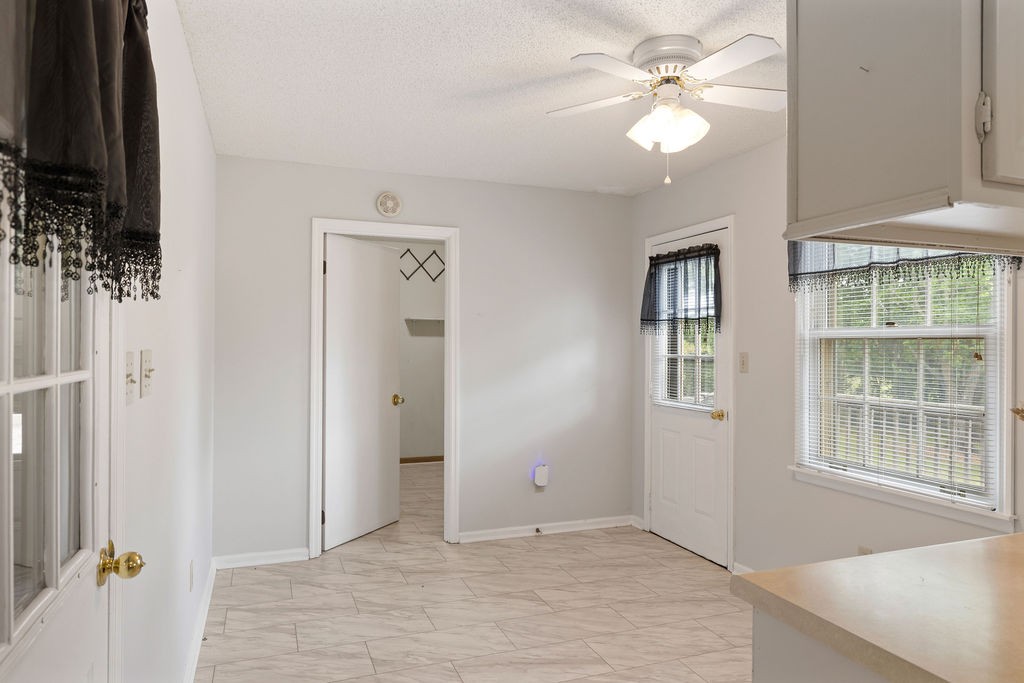 1684 Springplace Road Lewisburg, TN 37091 - Photo 15 of 31 wooden floor in an empty room with a window