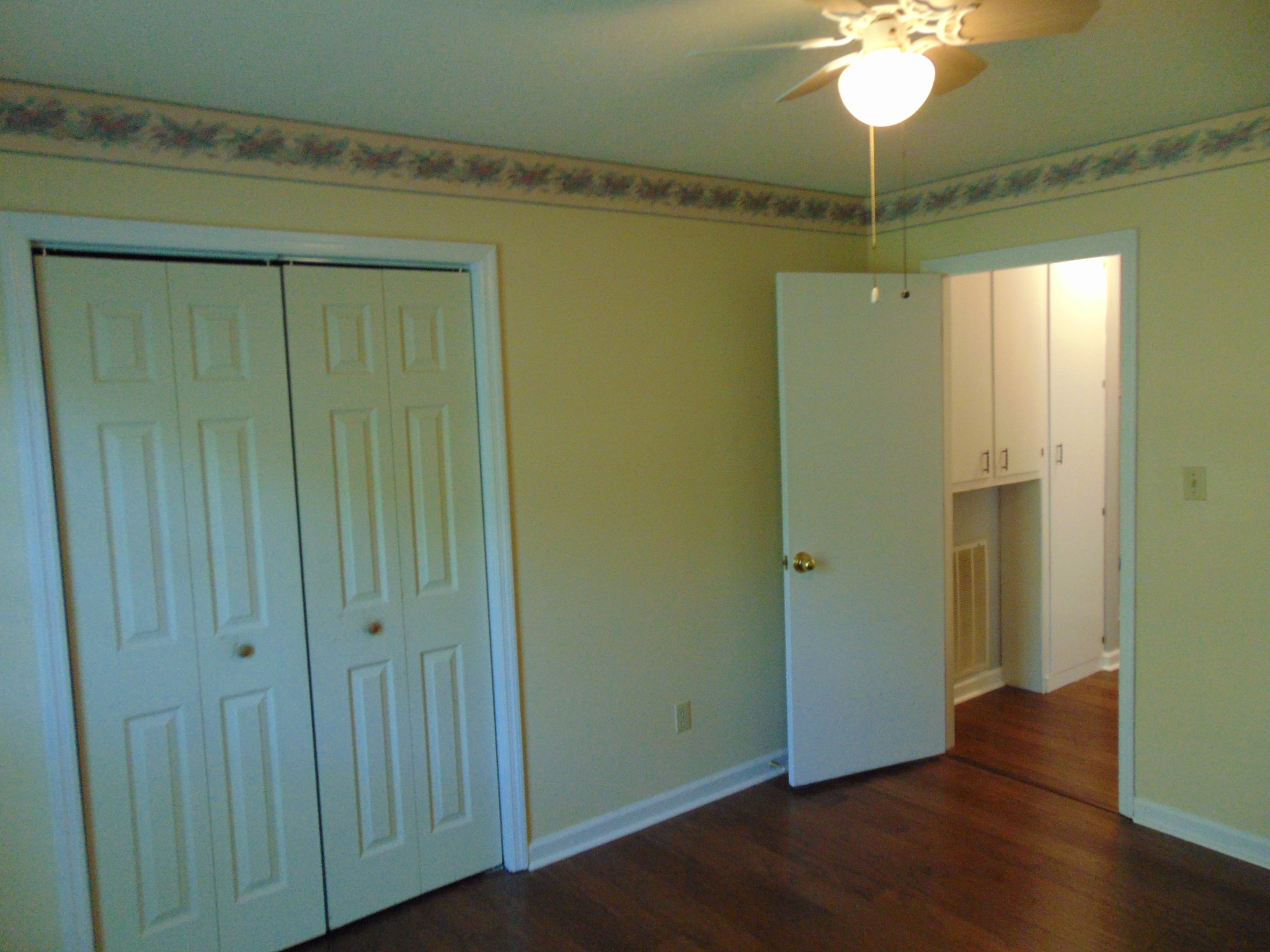 1684 Springplace Road Lewisburg, TN 37091 - Photo 16 of 48 a view of empty room with wooden floor and fan