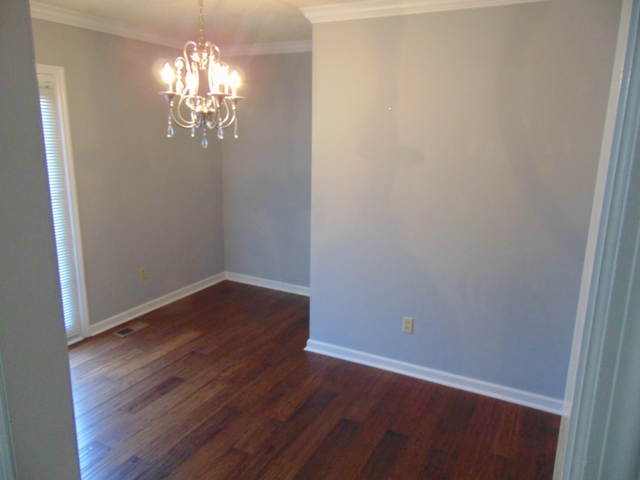 1684 Springplace Road Lewisburg, TN 37091 - Photo 17 of 48 a view of a chandelier in a room with wooden floor