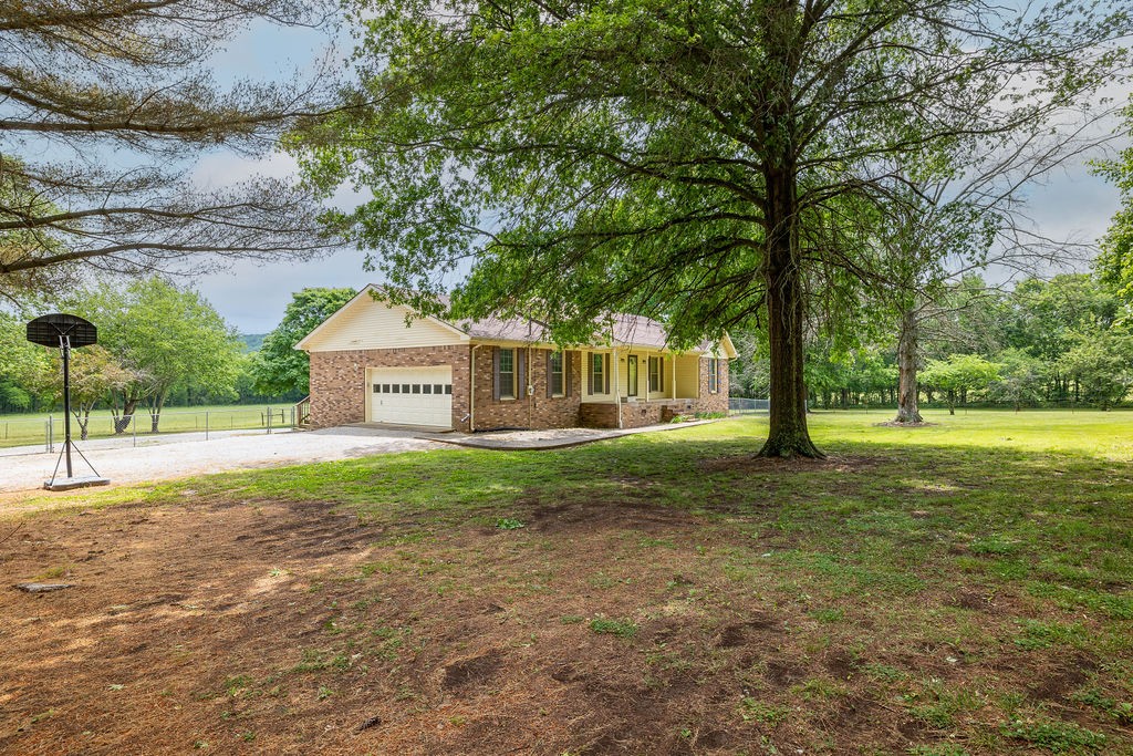1684 Springplace Road Lewisburg, TN 37091 - Photo 19 of 31 a view of a house with a yard