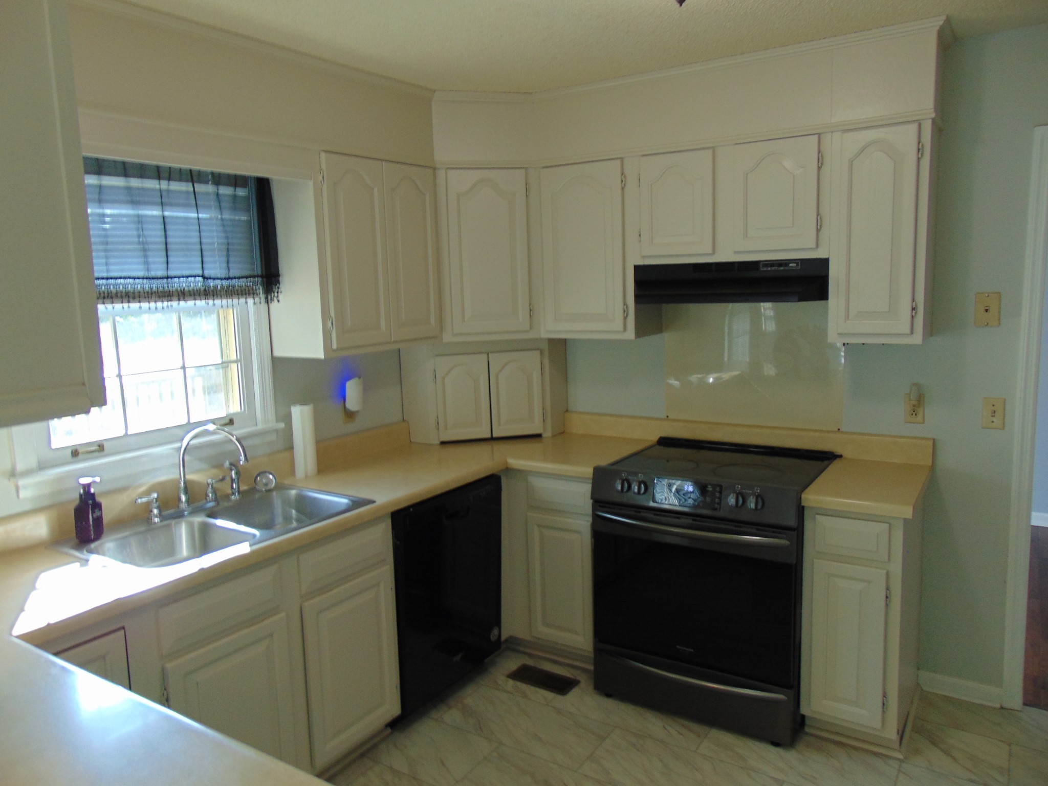1684 Springplace Road Lewisburg, TN 37091 - Photo 20 of 48 a kitchen with stainless steel appliances granite countertop a sink stove and cabinets