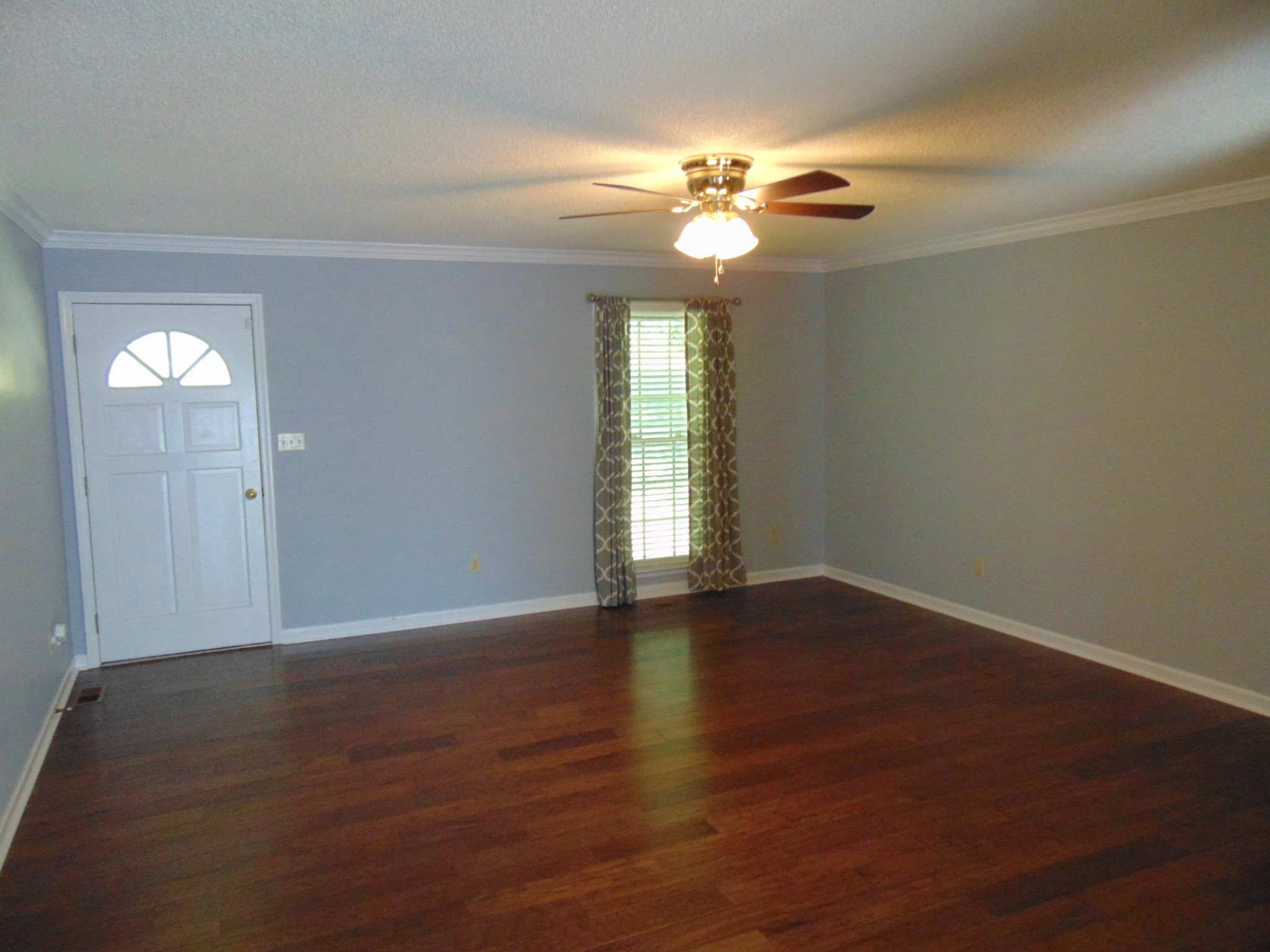 1684 Springplace Road Lewisburg, TN 37091 - Photo 2 of 48 a view of an empty room with wooden floor