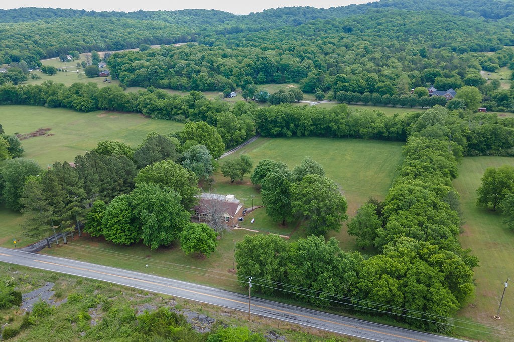 1684 Springplace Road Lewisburg, TN 37091 - Photo 30 of 31 an aerial view of green landscape with trees houses and lake view